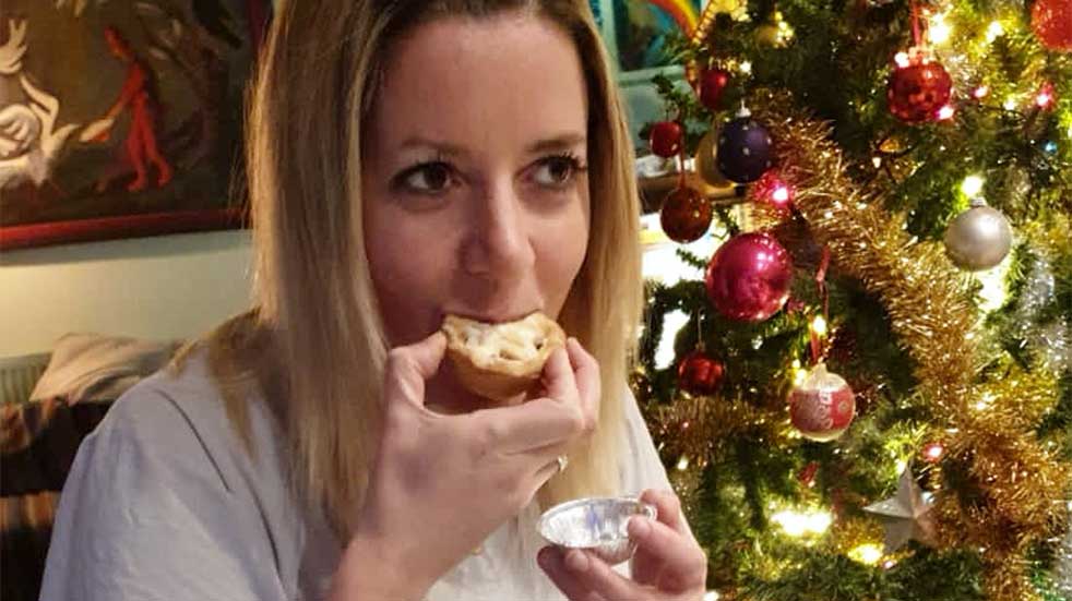 Mince pie taste test woman eating mince pie Christmas tree
